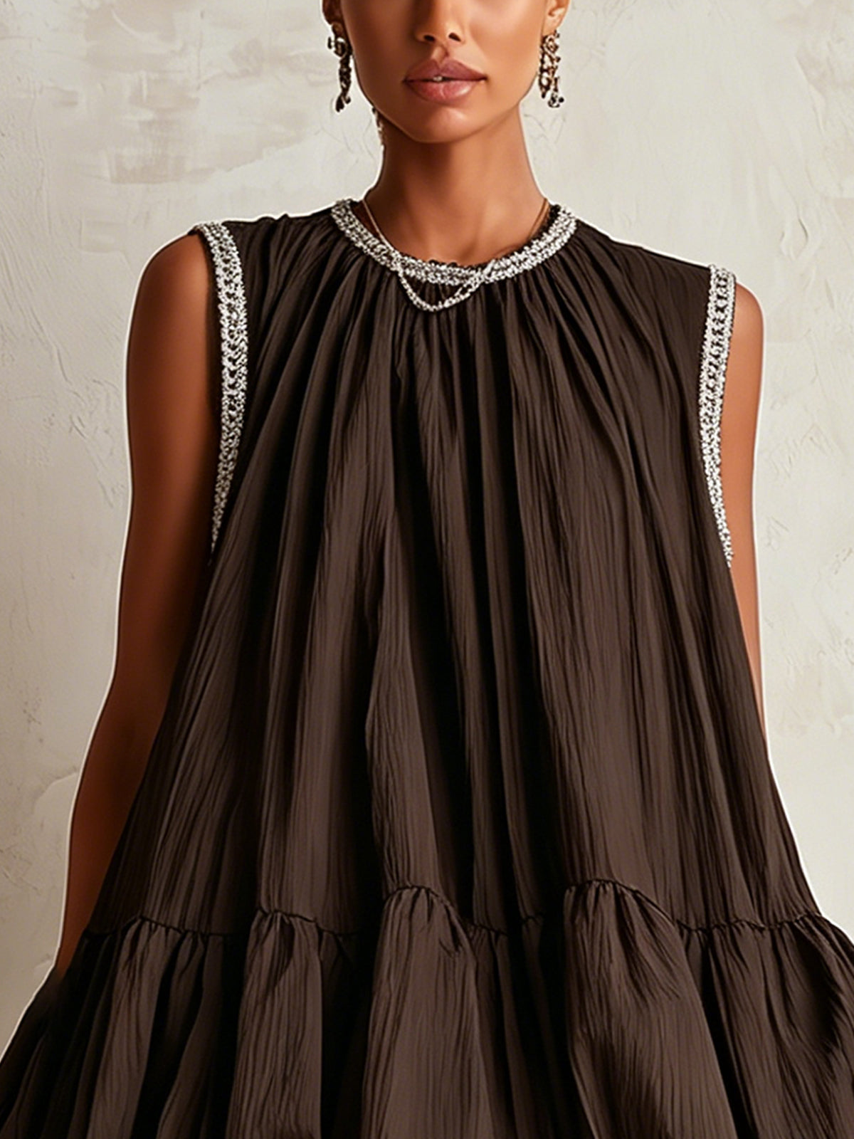 Brown sleeveless mini dress with a bubble hem